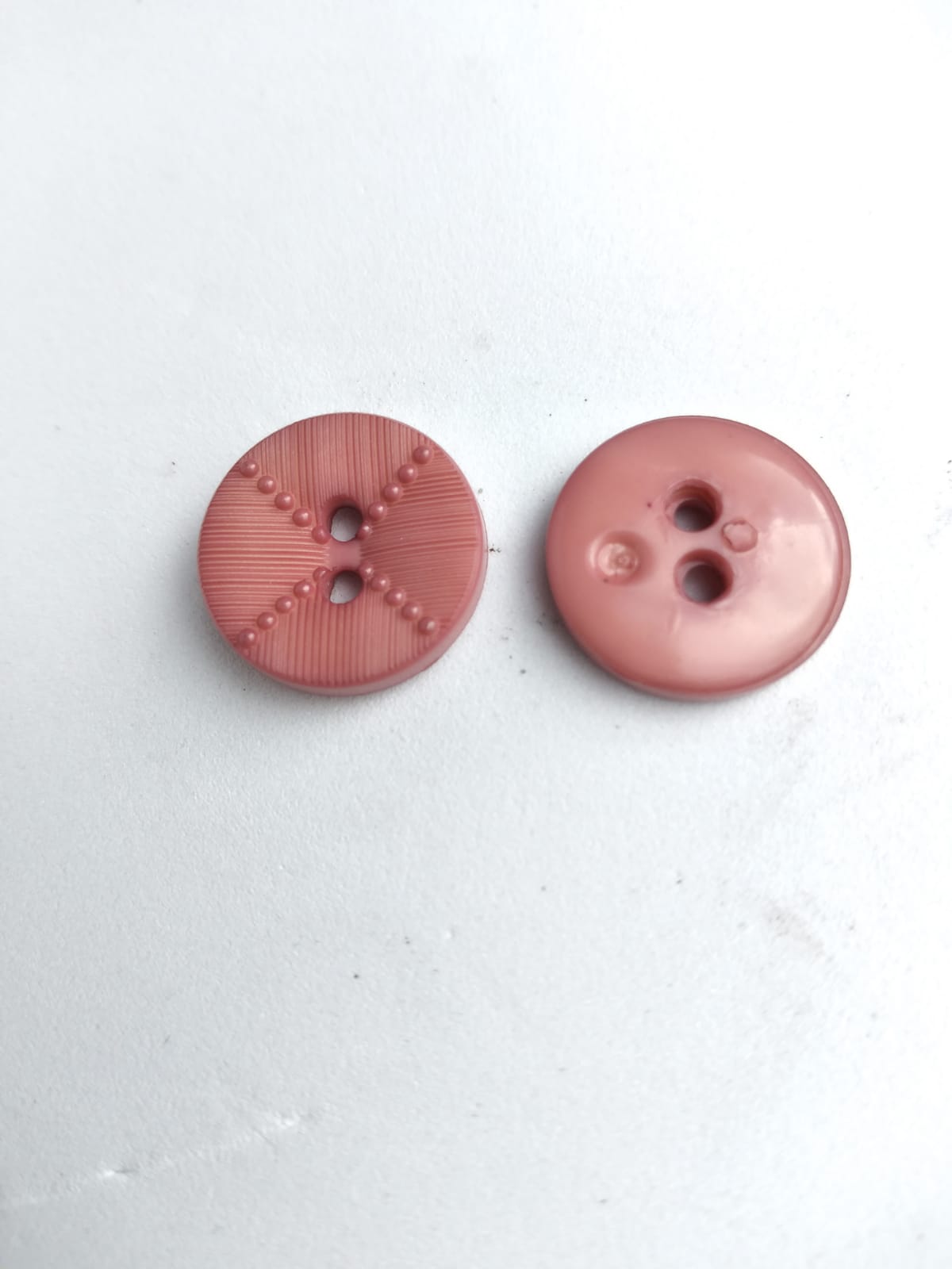 Knoop kunststof 15 mm oud roze